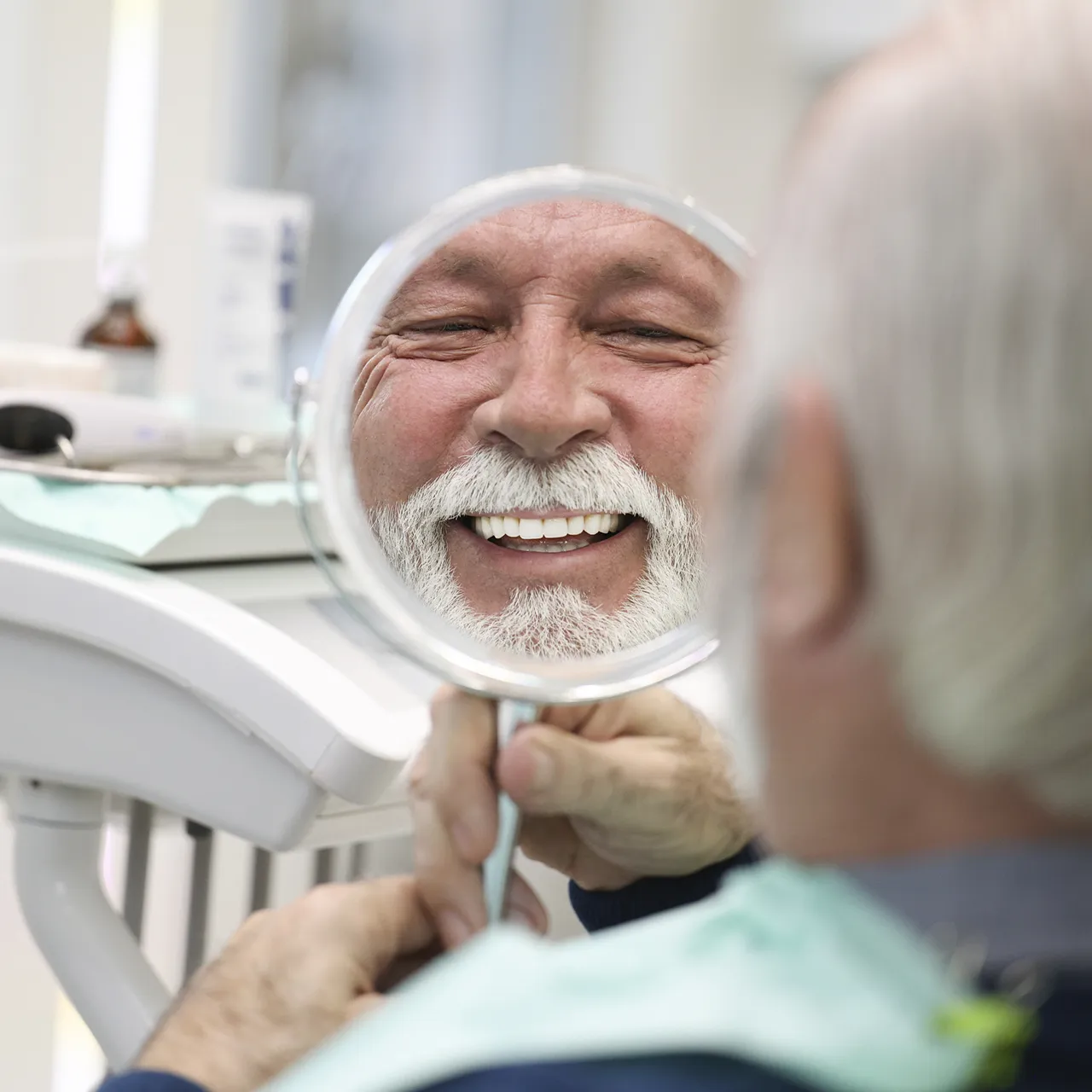 Man Smiling After Dental Implants Procedure