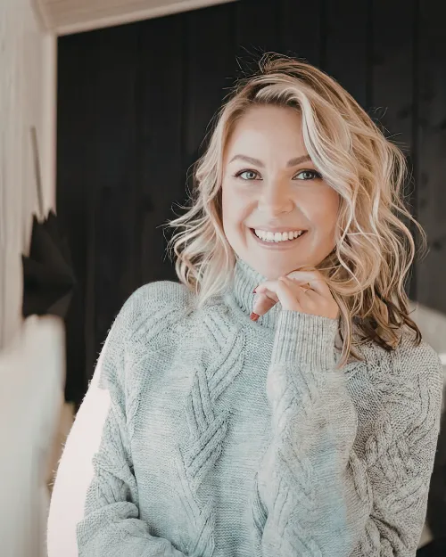 Woman Wearing Sweater Smiling